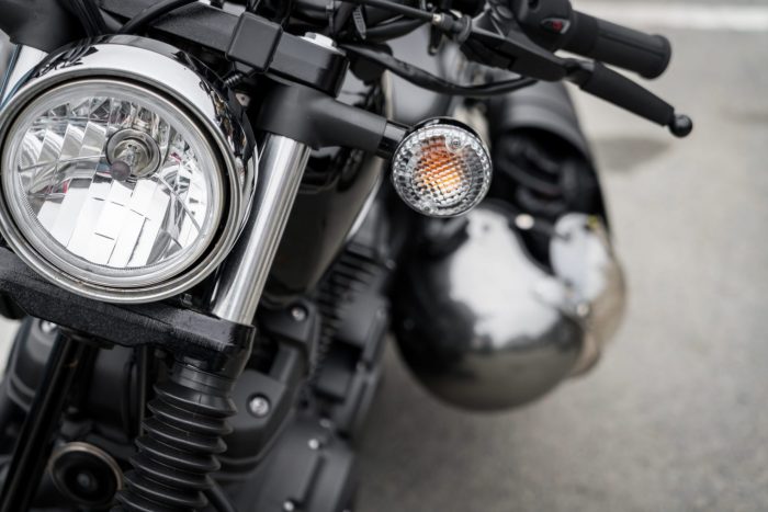 Photo of the front of a motorcycle illustrates blog: "4 Tips to Lower Your Motorcycle Insurance Rates"