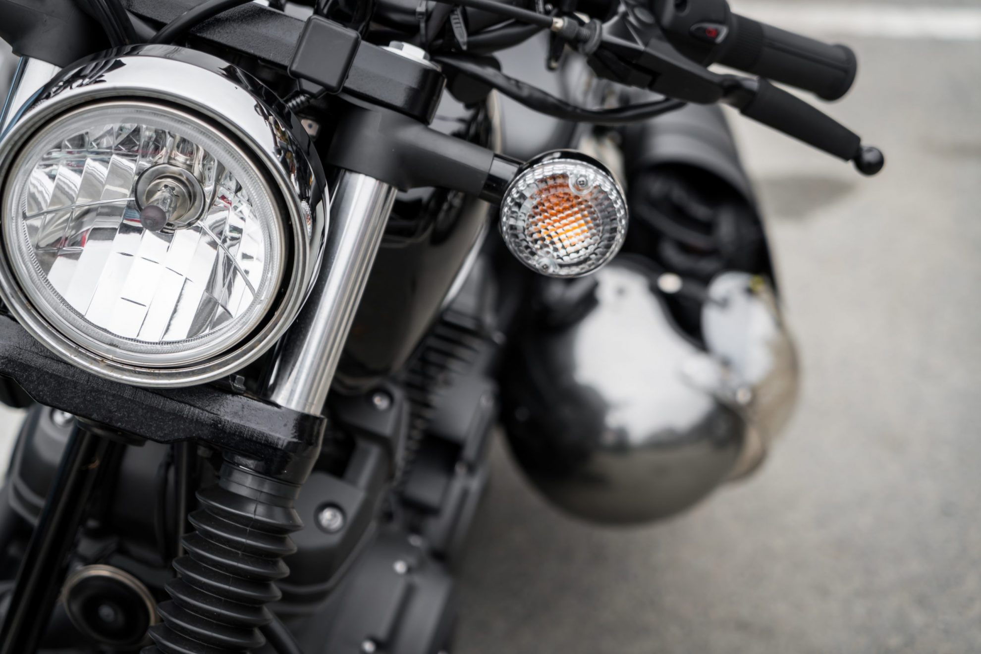 Photo of the front of a motorcycle illustrates blog: "4 Tips to Lower Your Motorcycle Insurance Rates"