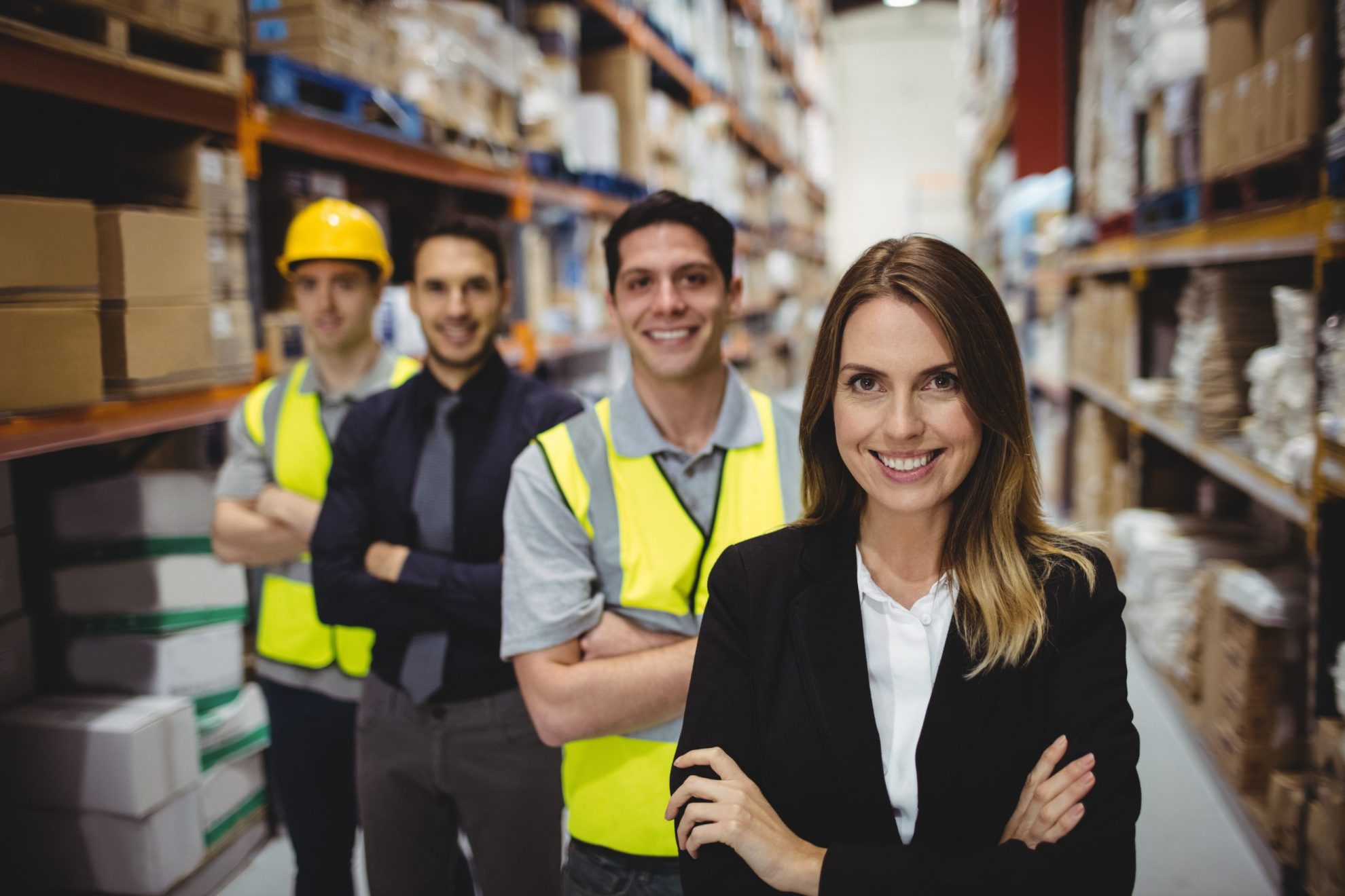 Photo of employees in warehouse illustrates blog: "Workers’ Compensation Insurance in Texas: The Basics"