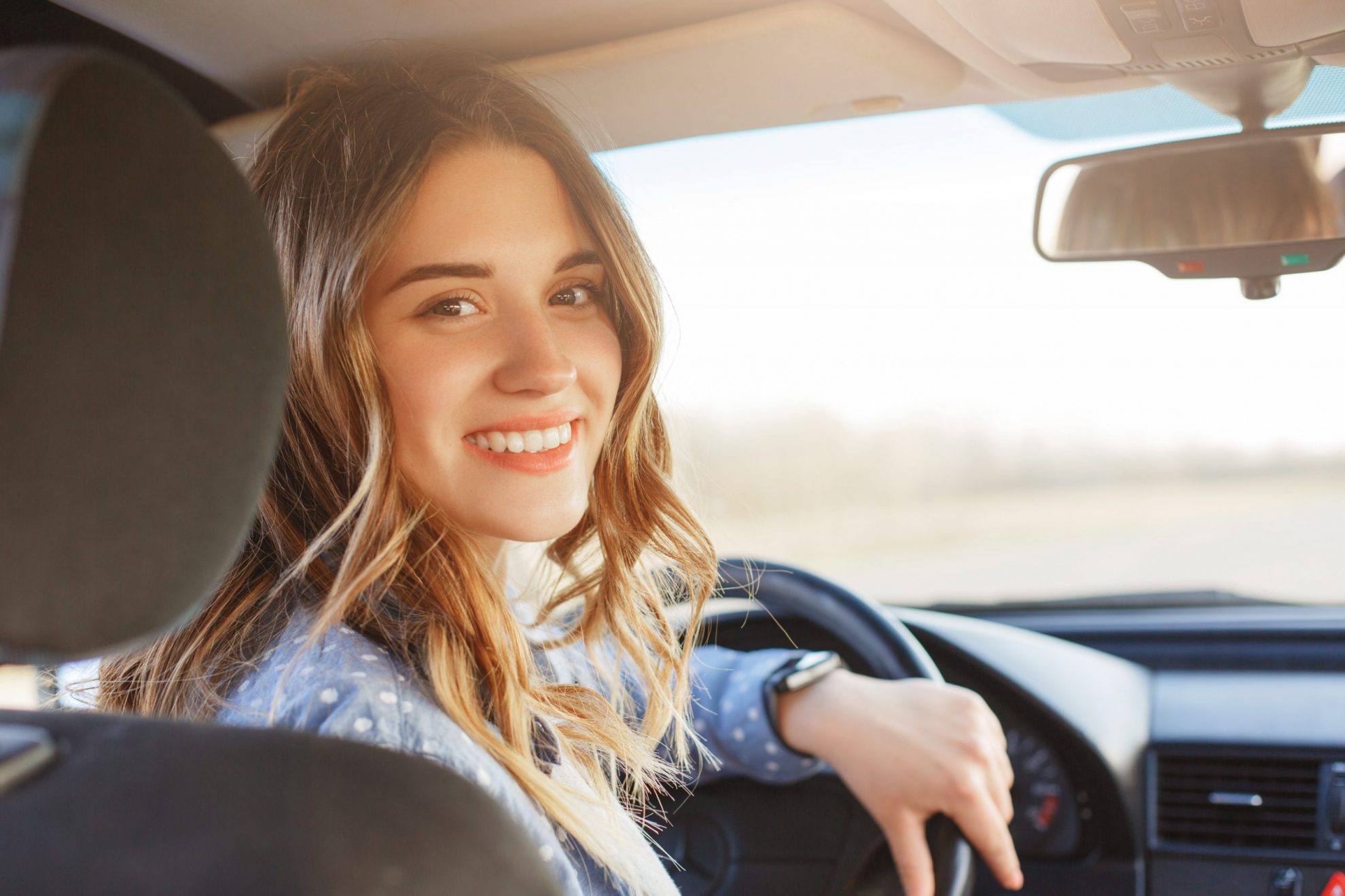 Photo of woman smiling in car illustrates blog: "Full Auto Insurance Coverage in Houston Texas: What You Need To Know"