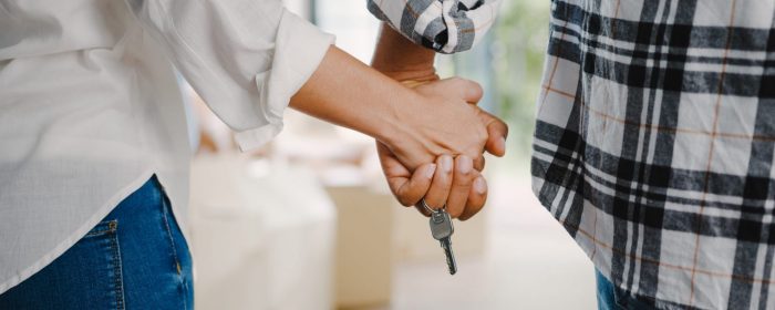 Photo of couple holding hands with keys hanging from their fingers illustrates blog: "HO3 vs HO5 Policies: What Is the Difference?"